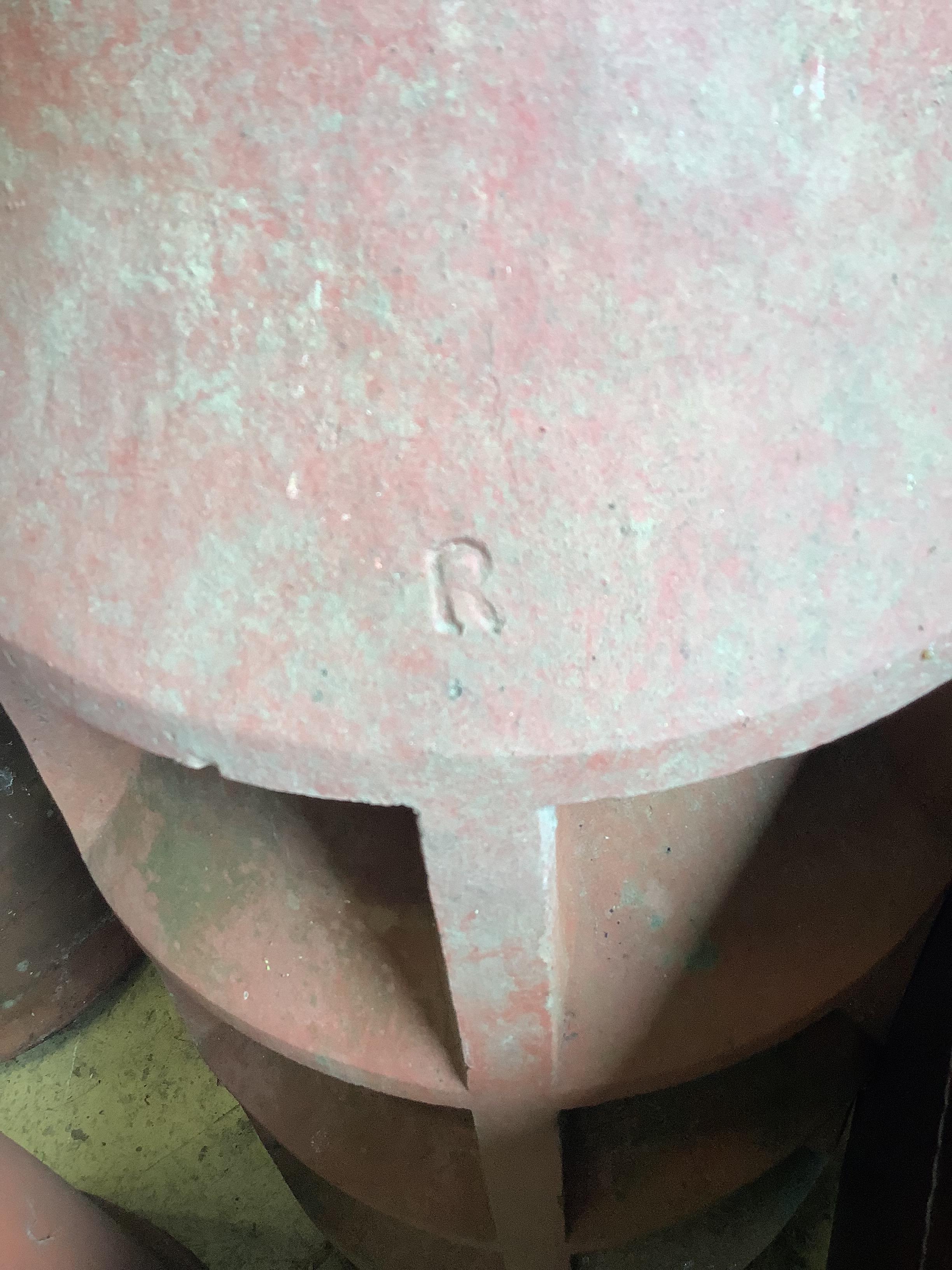 Three vintage terracotta chimney pots, largest 84cm high
